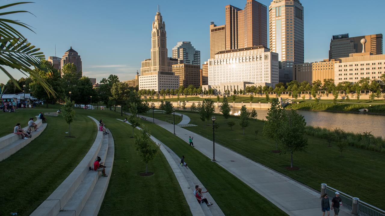 Columbus' Scioto Mile and Columbus skyline with people enjoying the green space
