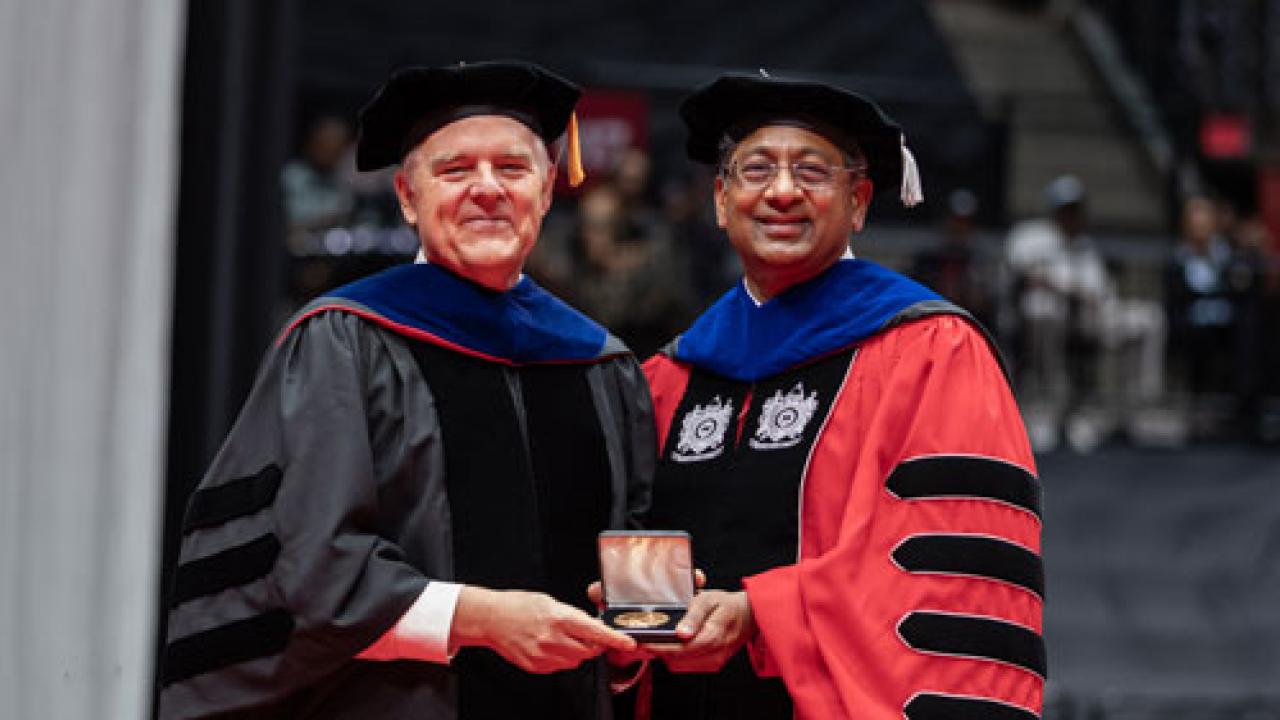 Sullivant Medal recipient Lars Bildsten with President Ravi V. Bellamkonda at summer commencement in 2026
